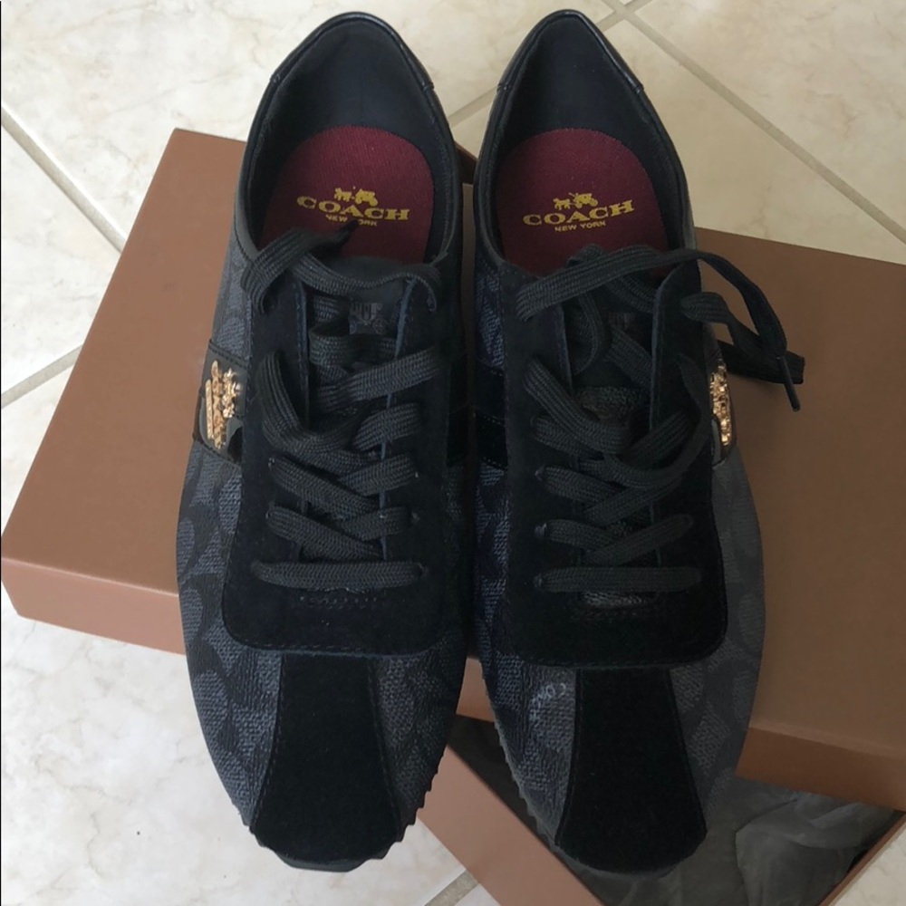 Coach women’s sneakers black with gold lettering